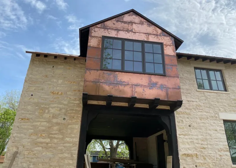 Copper metal panel facade on a stone building for Skylight Installation in Lucas Valley-Marinwood